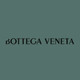 The image shows the words "BOTTEGA VENETA" in uppercase letters centered on a muted green background.