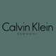 Calvin Klein eyewear logo in black text on a muted green background.